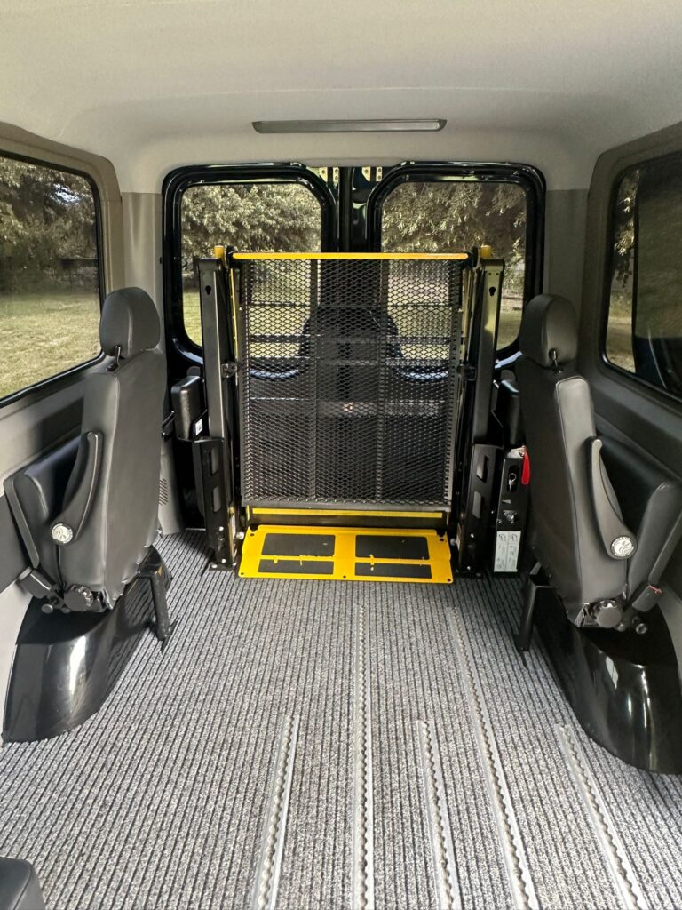 Passenger Assist WAV taxi with secure wheelchair tie-down system